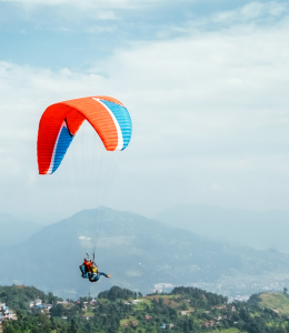 Soar above the picturesque Phewa Lake and lush landscapes of Pokhara with a paragliding adventure, offering breathtaking aerial views.